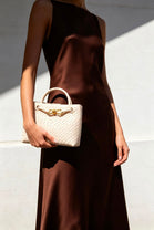 Premium Woven Top Handle Bag with Gold Knot Detail In Cream Pu