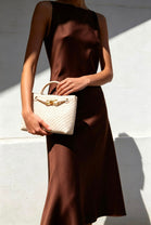 Premium Woven Top Handle Bag with Gold Knot Detail In Cream Pu