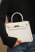 Crossbody Bag With Gold Lock in Textured Cream