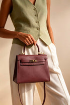 Crossbody Bag With Gold Lock in Textured Maroon