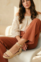 STUDDED RAFFIA CLOSED BACK ANKLE STRAP SANDALS IN GOLD