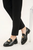 Black Patent Loafers with Gold Medallion Detail