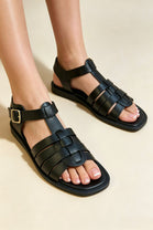 Black Faux Leather Fisherman Sandals With Gold Buckle Strap