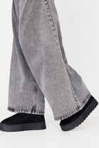 BLACK THICK SOLED SLIP ON FUR LINED ANKLE BOOTS