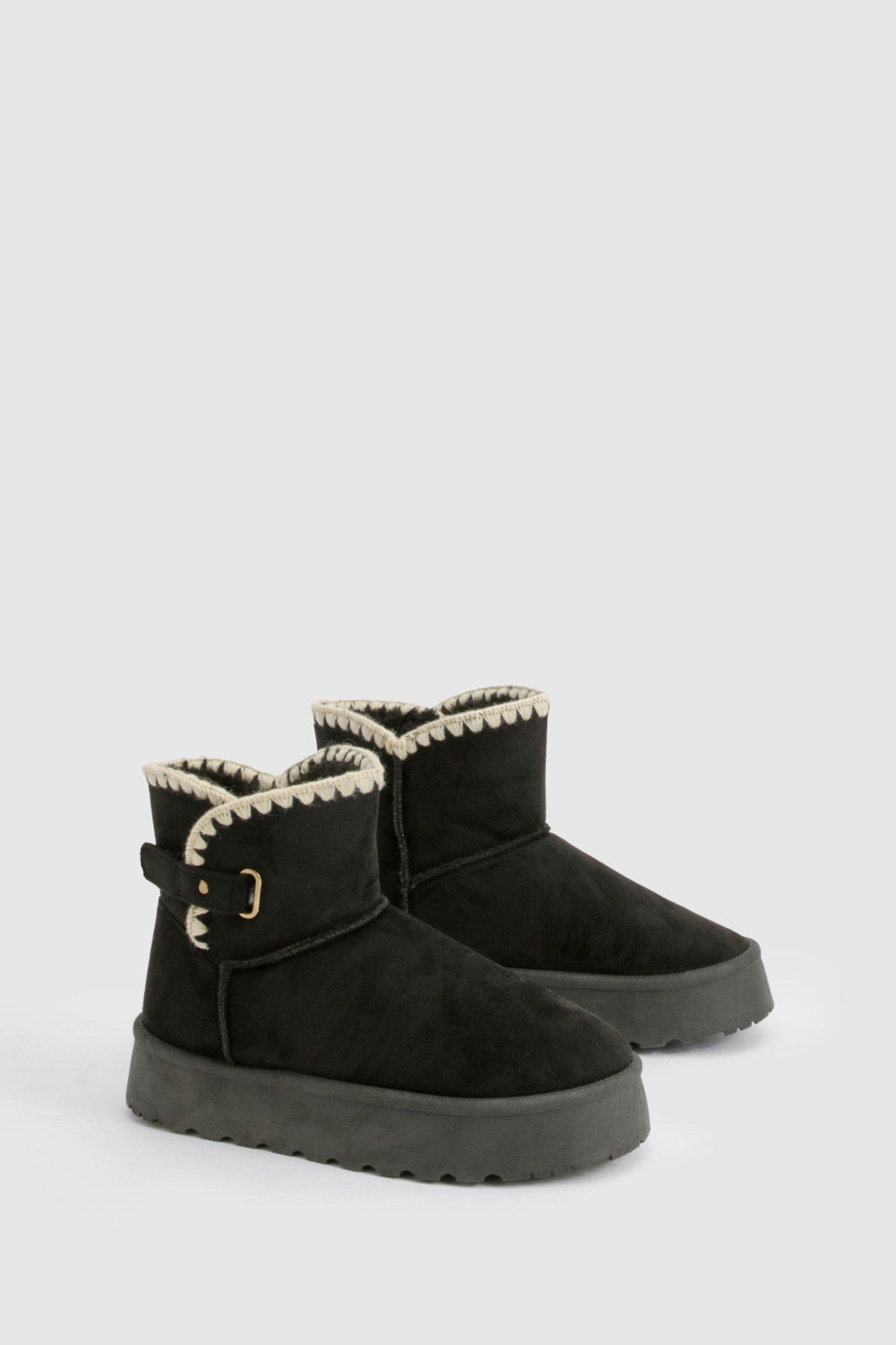 BLACK THICK SOLED SLIP ON FUR LINED ANKLE BOOTS