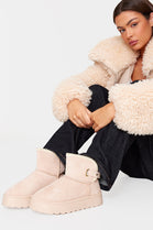 BEIGE THICK SOLED SLIP ON FUR LINED ANKLE BOOTS