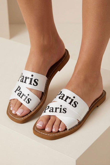 Women’s Printed Logo Flat Slide Sandals In White – Chic Summer Sliders