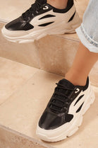 BLACK LACE UP FLAT TRAINERS