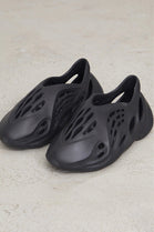 Black Slip On Rubber Trainer With Cutout Detail